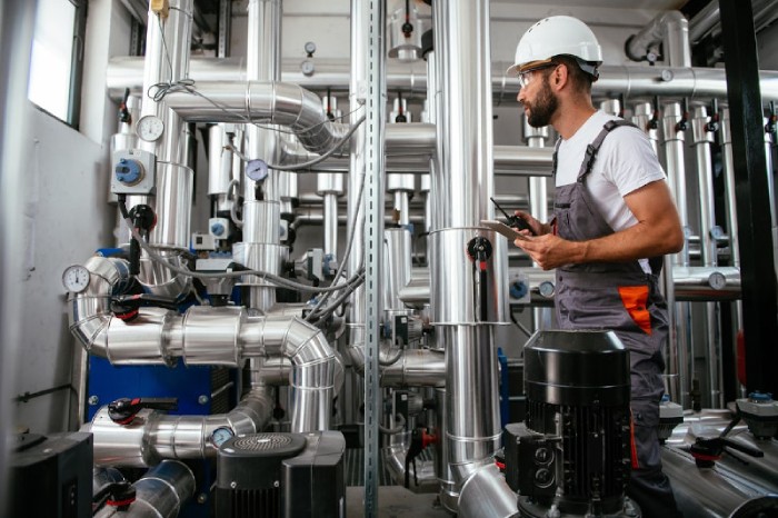 Technician Checking Commercial HVAC System