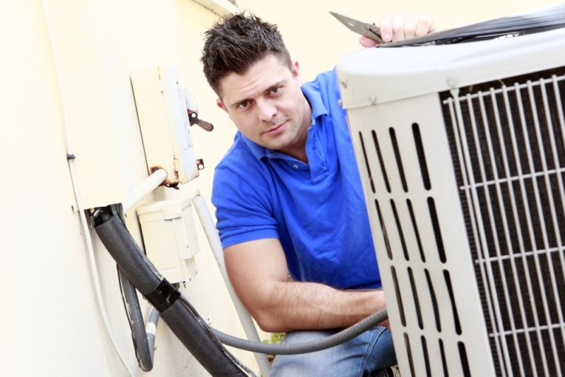 Man Checking Ac Shutterstock 73375426